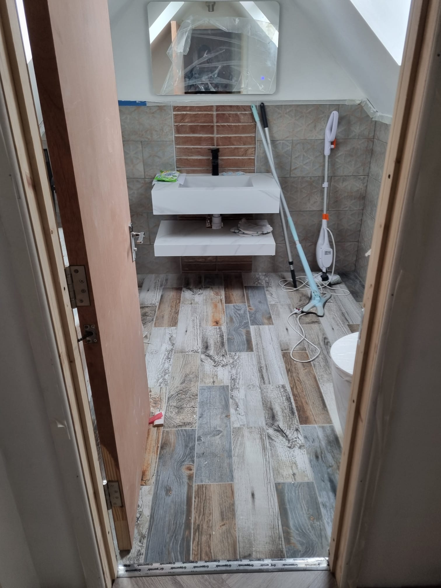 Modern bathroom renovation with tiling in Mansfield by IBS Services