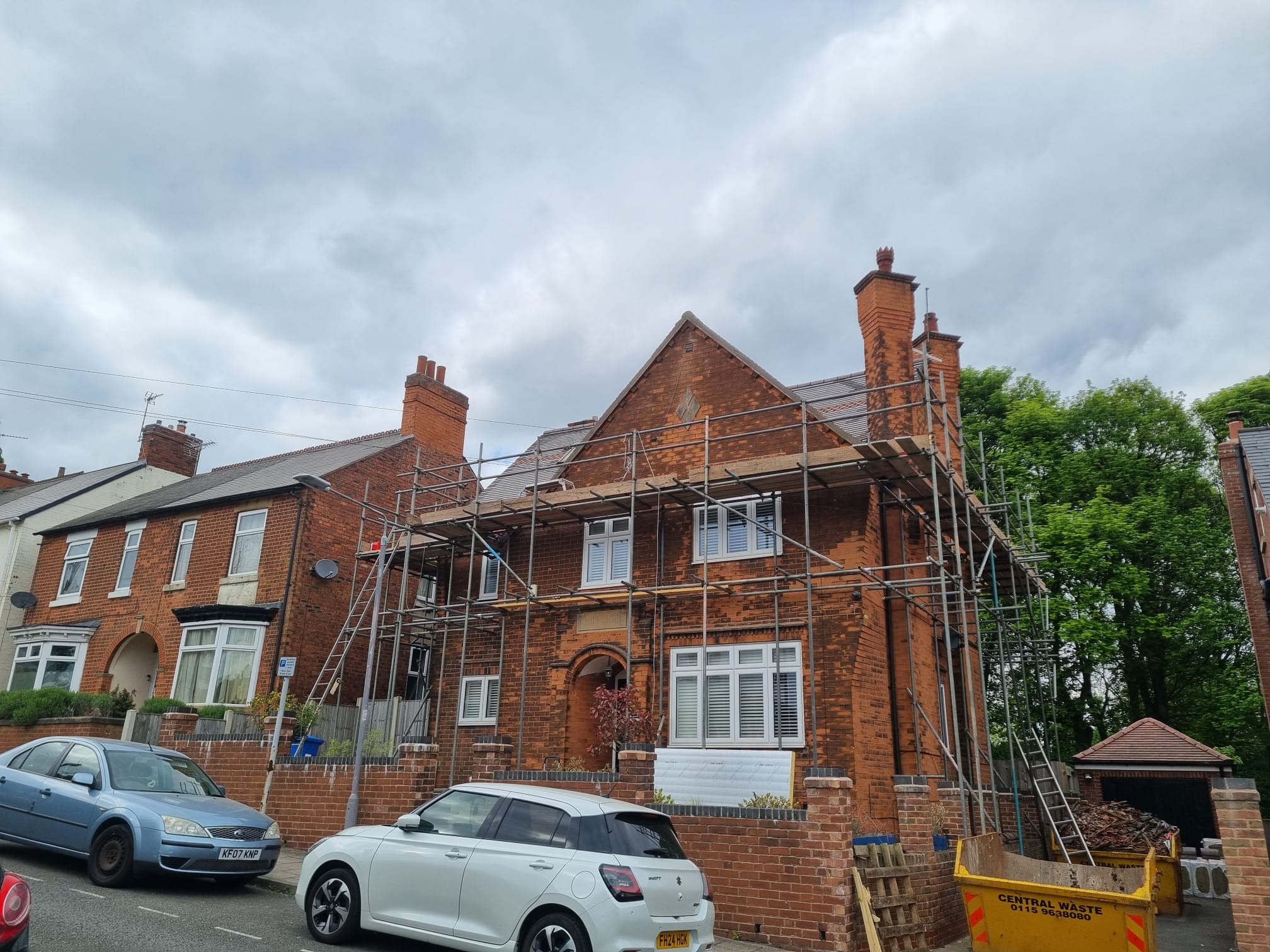 Front view of house extension project with scaffolding