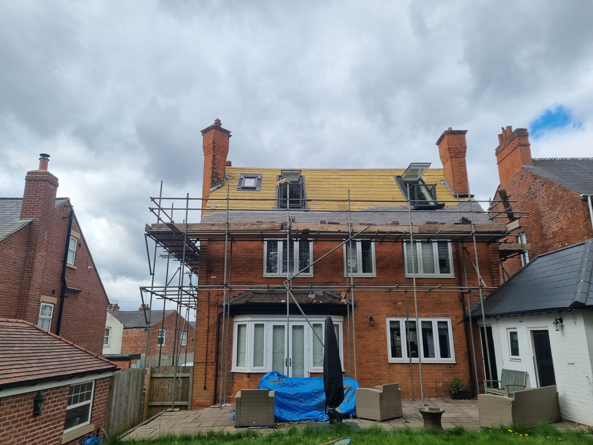 Roof tile installation on building project